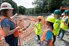 Historic preservation project manager Sarita Herman leads a tour of a construction site for girls during UVA FM's annual Girls Day