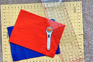 Cloth material lying atop a sewing mat