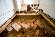 Herringbone patterned bricks are believed to be part of the original kitchen floor 