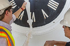 Workers remove Rotunda clock hands