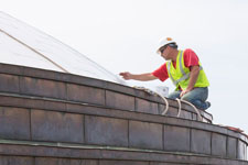 Worker paints new Rotunda roof