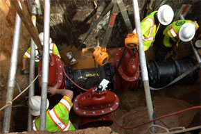 Utilities crew install new underground pipes