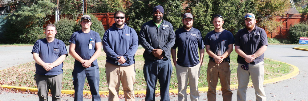 2021 UVA Apprenticeship Program graduates stand side by side in a row