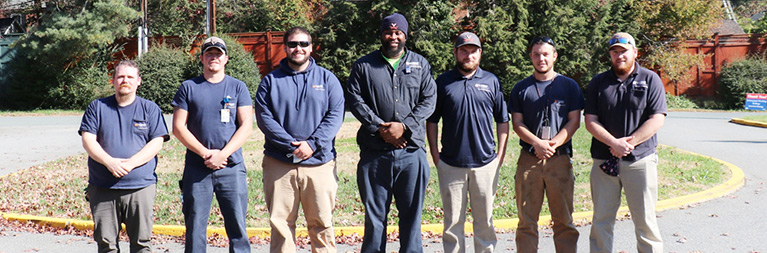 2021 UVA Apprenticeship Program graduates stand side by side in a row