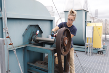 Ashley Bell works on a belt as part of the Chemistry Building's ventilation exhaust system