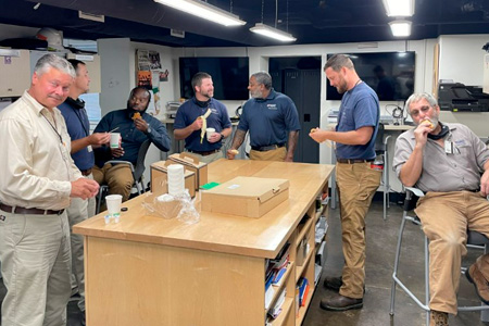 FM Elevator team having coffee and pastries
