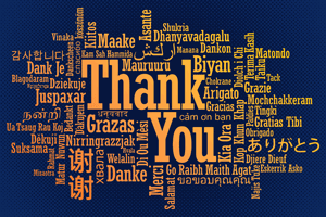 The phrase 'Thank you' written in several languages and scripts arranged in a word cloud style