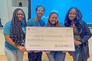 Students pose with oversized check.