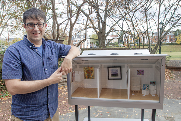 Chance Drummond with one of his mixed media artworks