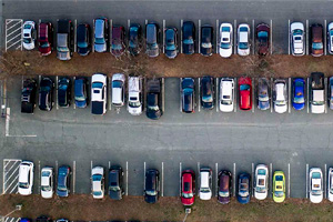 Aerial view of a parking lot filled with cars