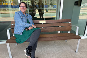 Trish Romer on a memorial bench