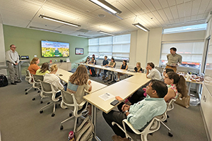 A group attending a presentation in a conference room