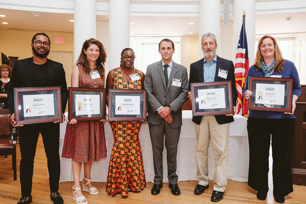 Recipients of Hoos Building Bridges awards stand with President Jim Ryan