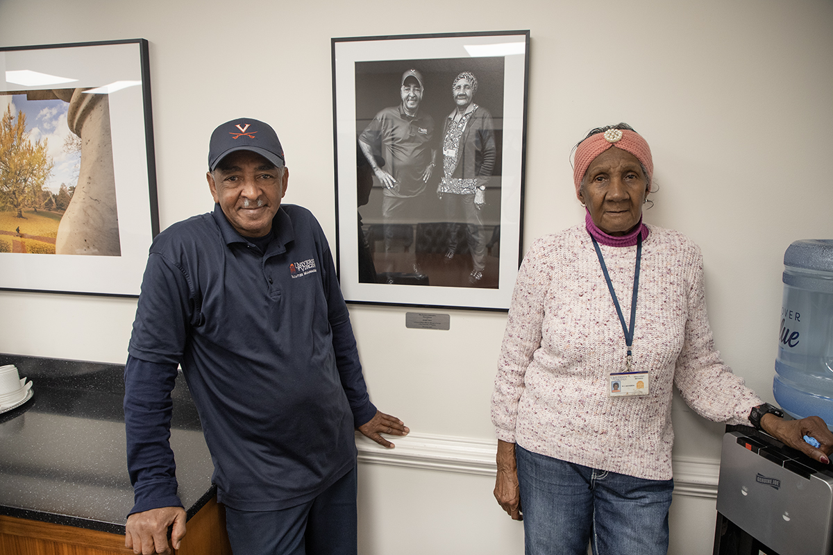 Joseph Gaines and Mary Johnson stand in front of their framed portrait