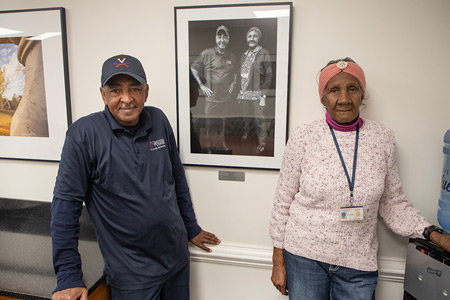 Joseph Gaines and Mary Johnson stand in front of their framed portrait