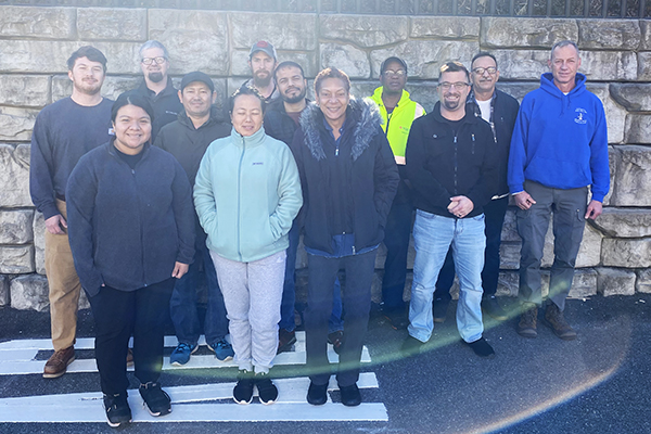 Group photo of new employees that joined Facilities Management since December 2023