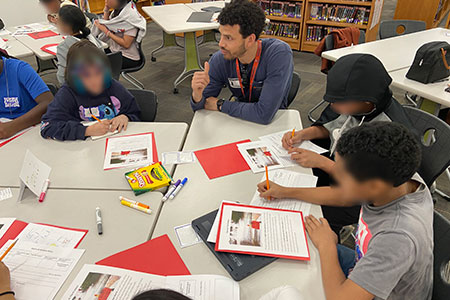 Utilities Supervisor Marcus Klaton leads a problem-solving activity with Journey Middle School students in March.