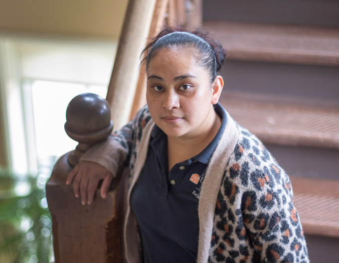 Indra Adhikari stands on a stairwell