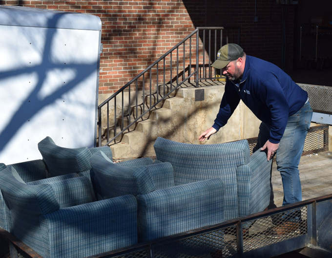 Jason Dalton loads chairs onto a trailer