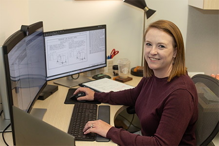 Abby Tanner sits at her desk