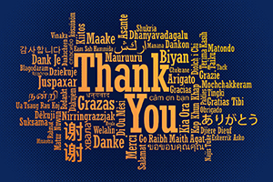 The phrase 'Thank you' written in several languages and scripts arranged in a word cloud style
