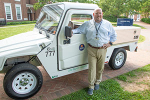 Newcomb Zone Manager Jamie Joyner poses with one of the department’s electric vehicles that produces zero emissions while driving.