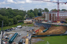 Wide view of water tanks being installed in the ground around Nameless Field