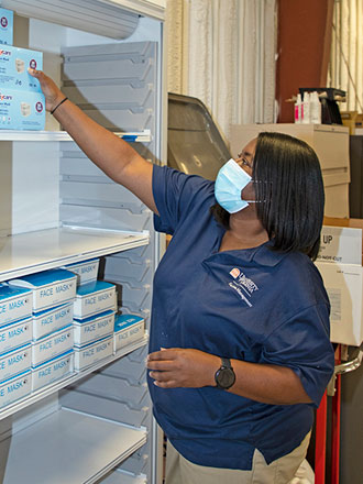An FM employee restocking a shelf