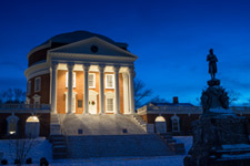 The Rotunda illuminated at dusk in the snow