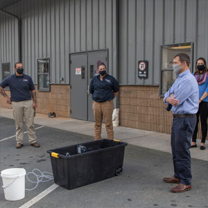 UVA President Jim Ryan meets outdoors with Utilities staff outdoors