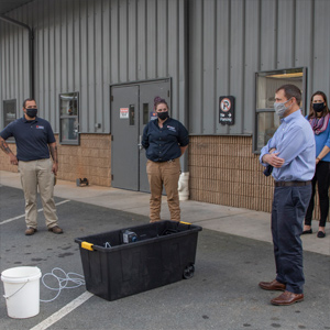 UVA President Jim Ryan meets outdoors with Utilities staff outdoors