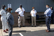 UVA President Jim Ryan meeting outdoors with FM Custodial staff