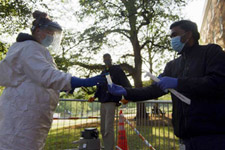 Wastewater testing technicians exchanging wastewater samples