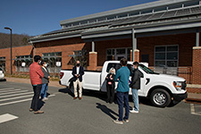 Members of the Fleet team and engineering students meet outside Skipwith Hall