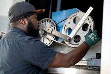 Lester Jackson working on machinery of an elevator