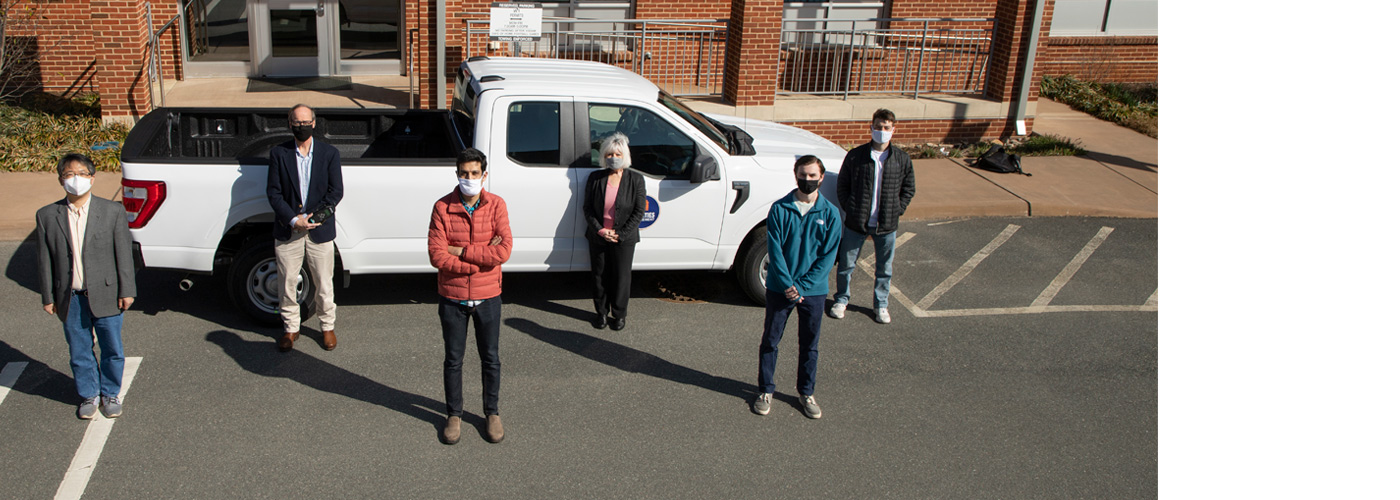 Members of the Fleet team stand with engineering studnets