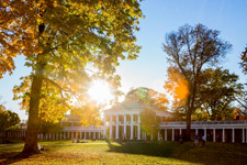 Sunlight shining through the trees around the Rotunda
