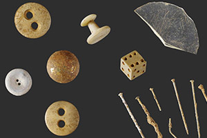 Buttons, dice and nails that were uncovered during the excavations.