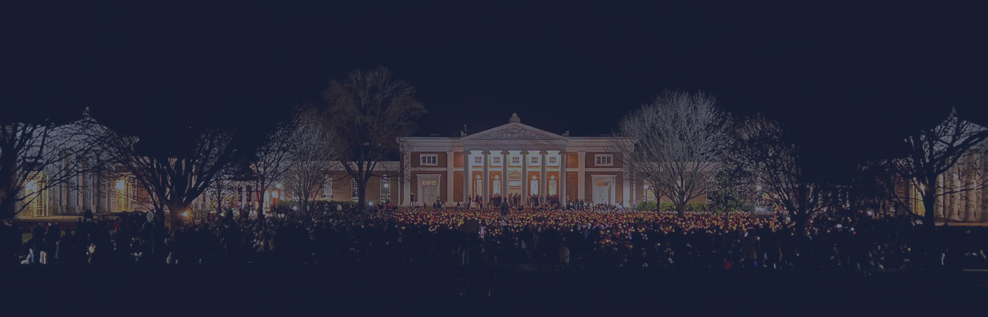A wide-angle shot of a candlelight vigil on The Lawn, through a UVA blue filter