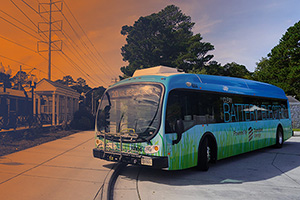 Electric bus pulling into a stop