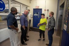 Young man speaking with UVA Elevator and Priority Elevator staff