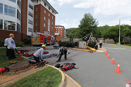 Firefighters preparing equipment for a rescue training exercise