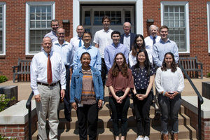 Group photo of several members of FM leadership with UVA Engineering students and a professor
