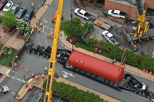 A heat recovery chiller tank being installed by crane