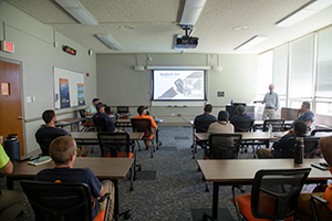 Transportation Operations and Fleet Manager Michael Duffy hosts a Mindful Driver training session with a group of Construction & Renovation Services employees.