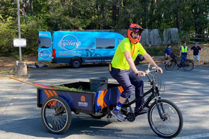 UVA staff member test riding a bike