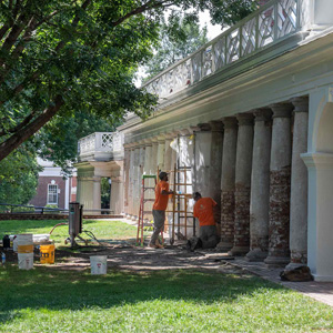Facilities Management's historic masons restore the Tuscan columns in the colonnade between Pavilion VII and Pavilion IX