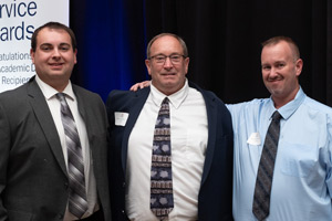 Charlie Durrer with his two sons at UVA's service awards