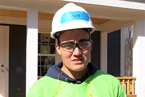 Ryan McCarthy being interviewed in hard hat