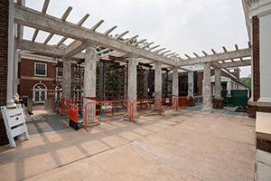 Columns outside Old Cabell Hall supporting a cement pergola
